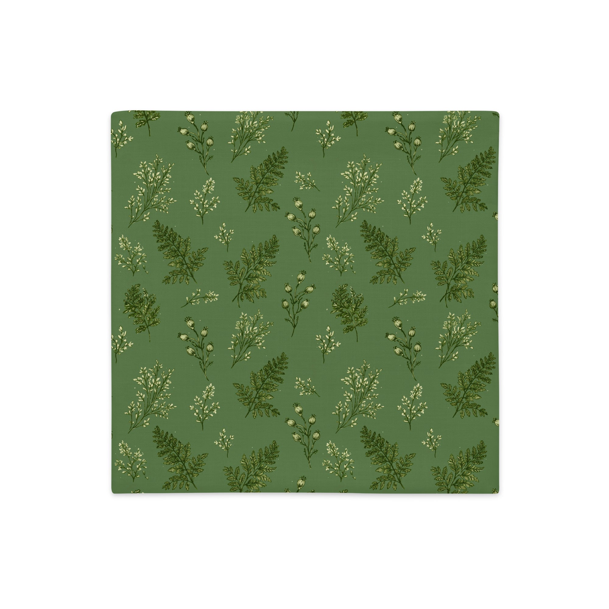 A square fabric or paper napkin featuring a repeating botanical pattern of green ferns and small white flowers on a muted sage green background, shown flat against a white backdrop.