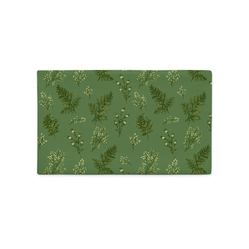 A rectangular placemat with a green background and a repeating pattern of delicate white and dark green wildflower illustrations, shown on a plain white background.