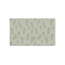 A rectangular pillow cover featuring a repeating pattern of muted sage green botanical stems and tiny gold dots on a light sage green background, shown flat against a white background.