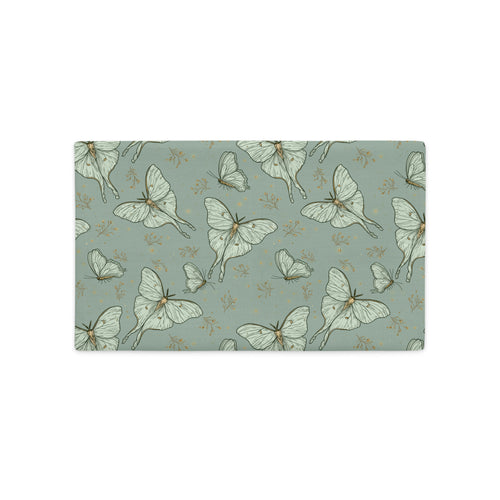 A rectangular fabric placemat or table mat featuring a repeating pattern of pale green and white moths and butterflies on a muted sage green background.