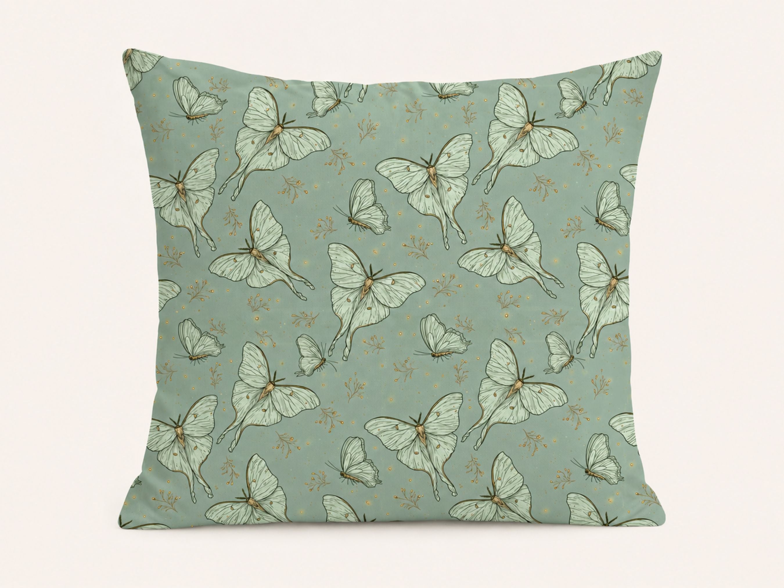 A square throw pillow featuring a repeating pattern of pale green and white luna moths on a muted sage green background, with tiny gold floral accents.